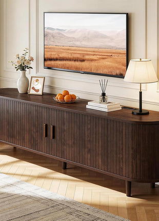 65-Inch Mid-Century Modern TV Stand with Power Outlet, Fluted Entertainment Center with Storage and Adjustable Shelves, Wood TV Console with Sliding Doors in Walnut Finish
