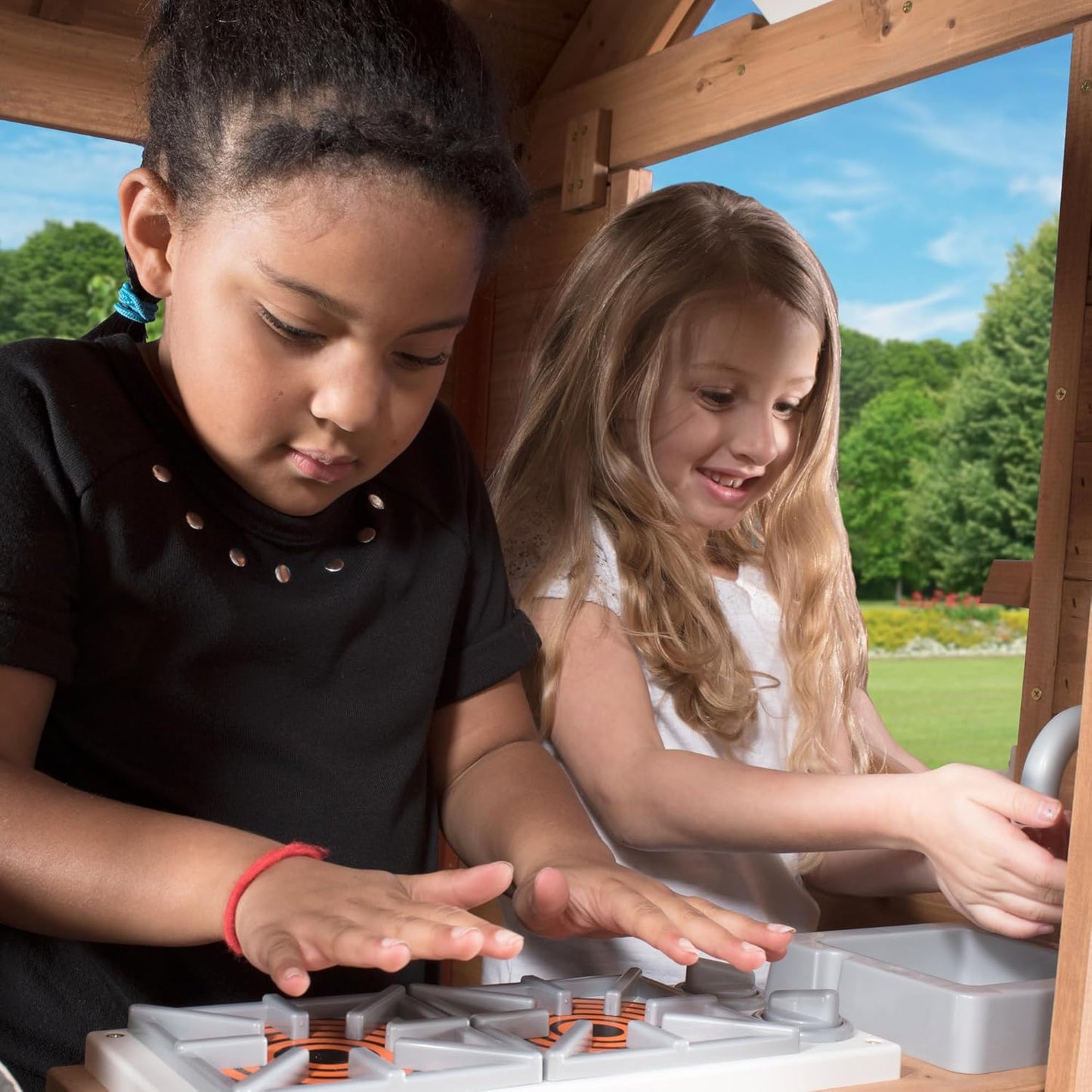 Scenic Heights Elevated Cedar Wooden Kids Playhouse with Play Kitchen, Wrap-Around Deck, Toy Storage Bench, Saloon-Style Doors, Ladder, Stairs, and Growth Chart for Outdoor Play